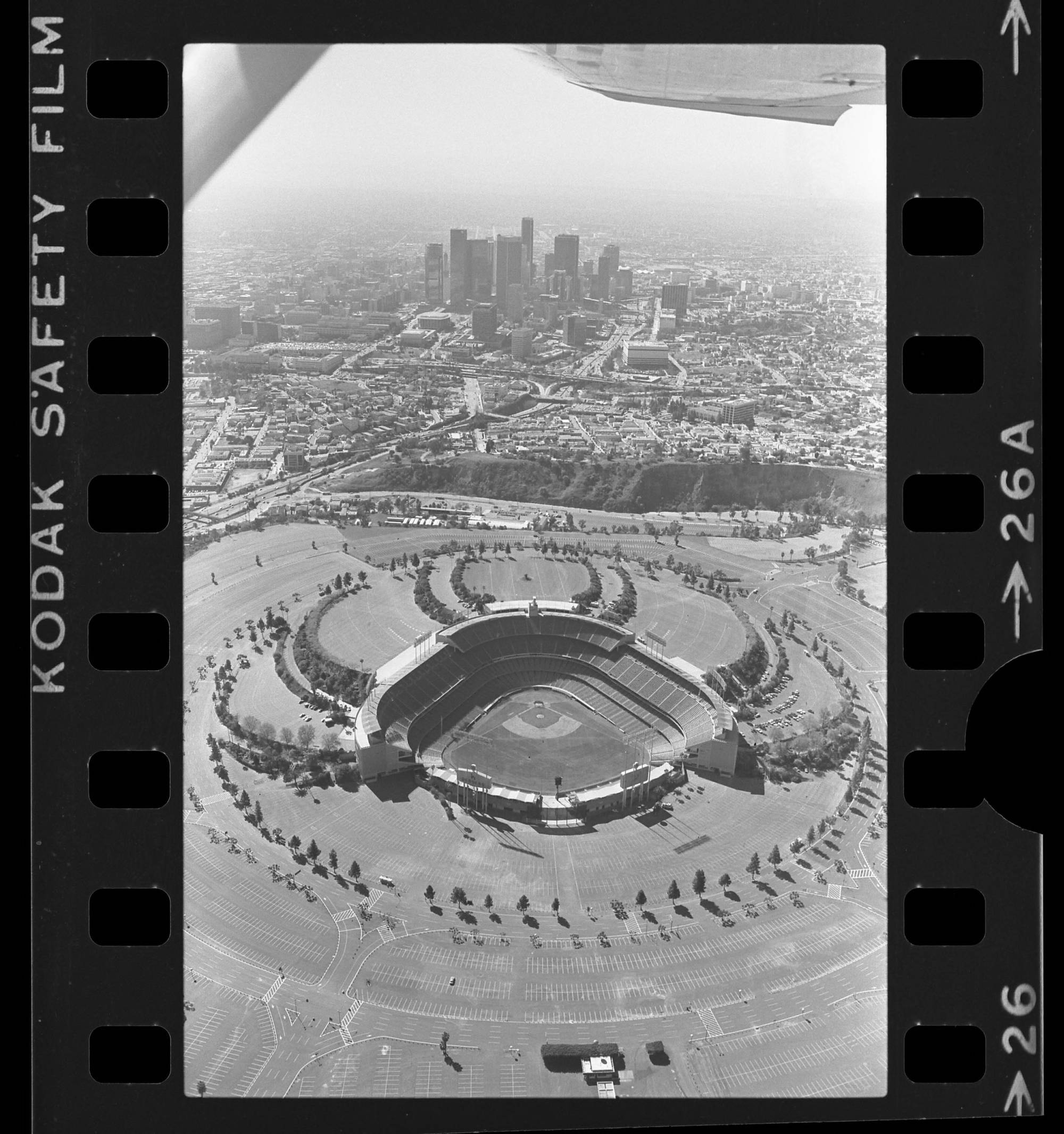 Aerial view of Dodger Stadium with downtown Los Angeles in background, 1985