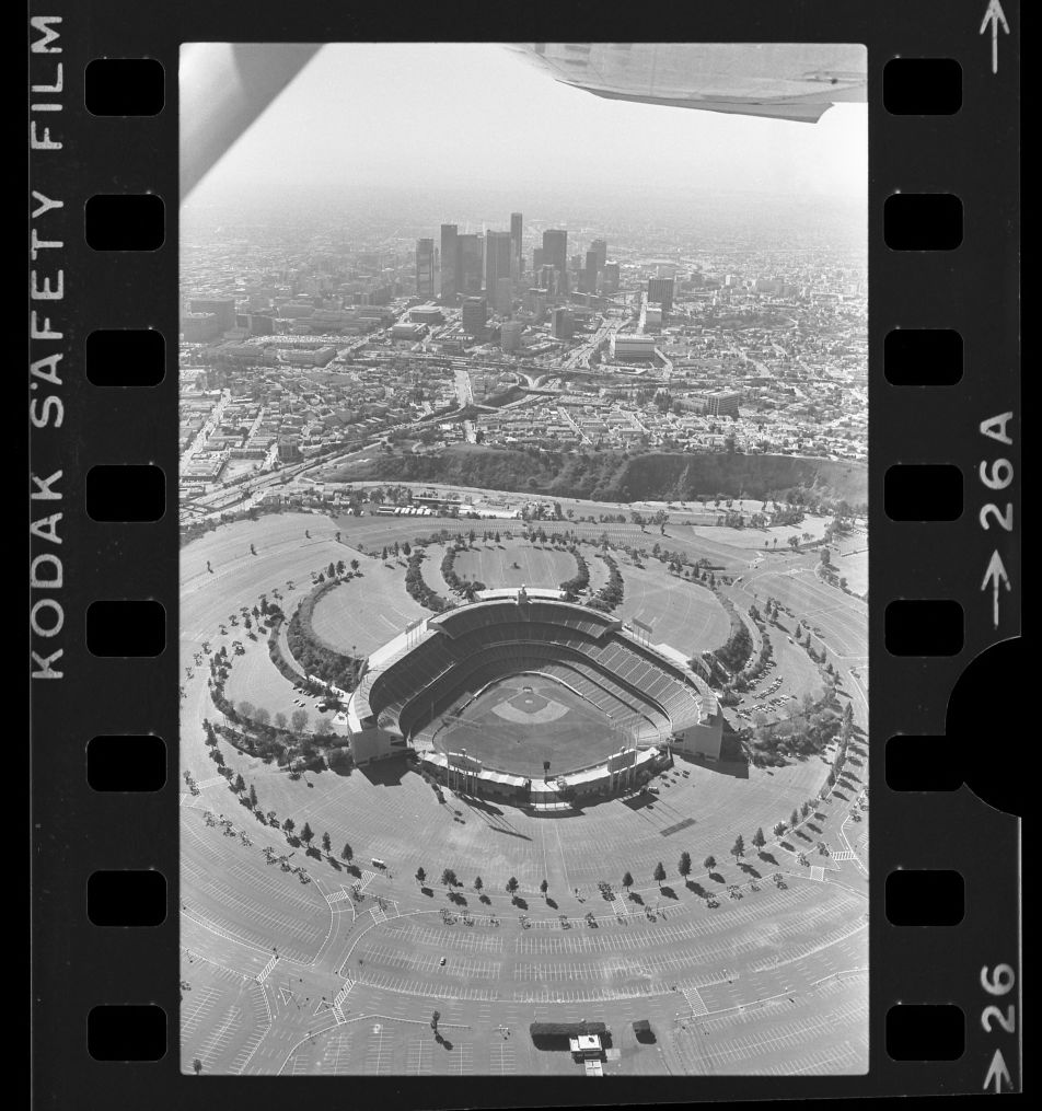 Aerial view of Dodger Stadium with downtown Los Angeles in background, 1985